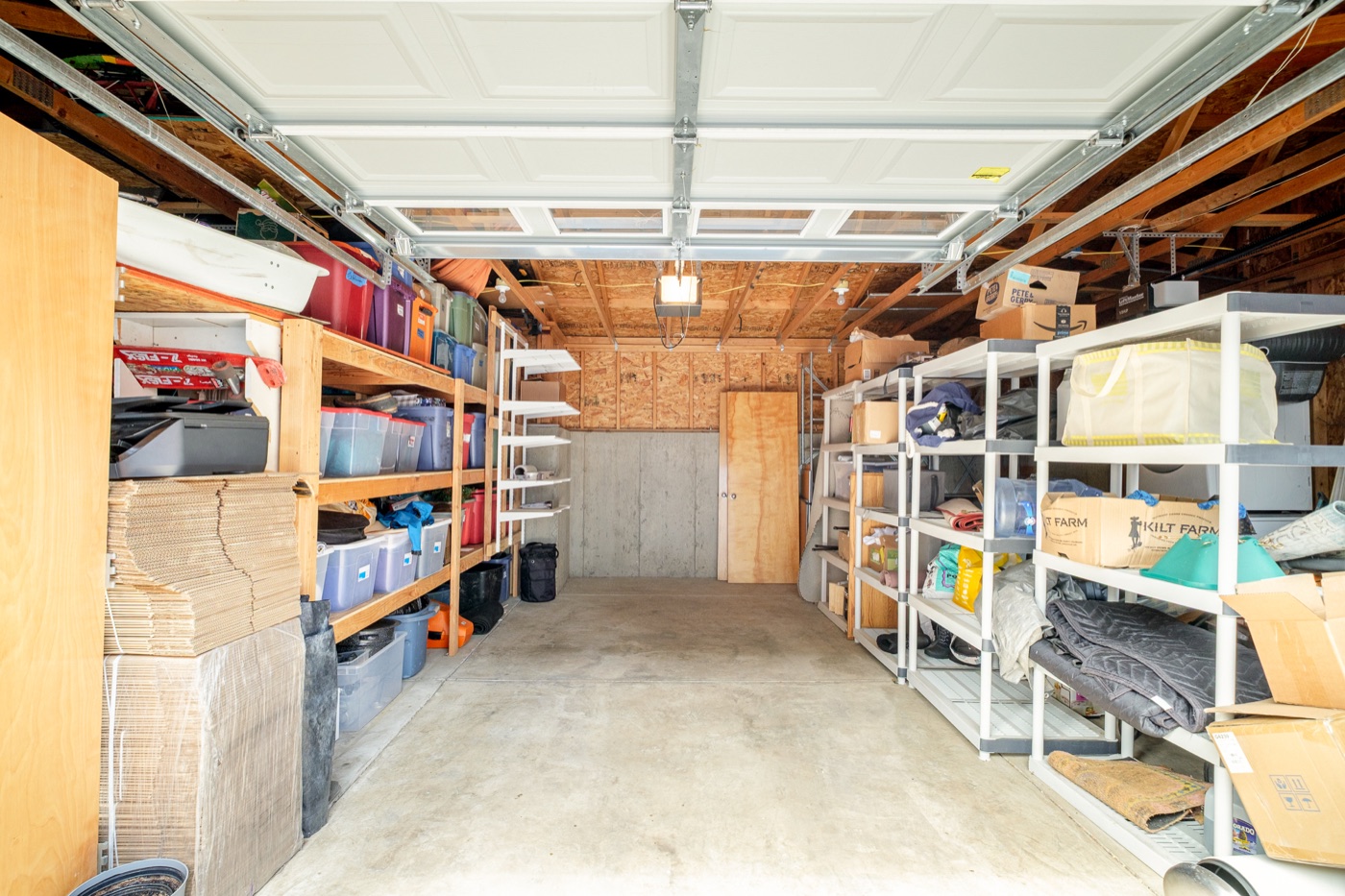 Interior of detached garage with storage at 1617 Yellow Pine Ave